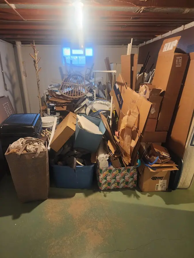 Roll-off dumpster container at job site for Concrete Dumpster Rental in Hampden